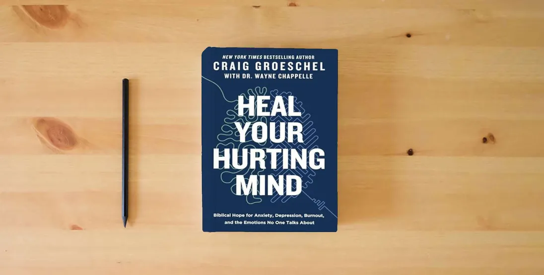 The book Heal Your Hurting Mind: Biblical Hope for Anxiety, Depression, Burnout, and the Emotions No One Talks About} is on the table