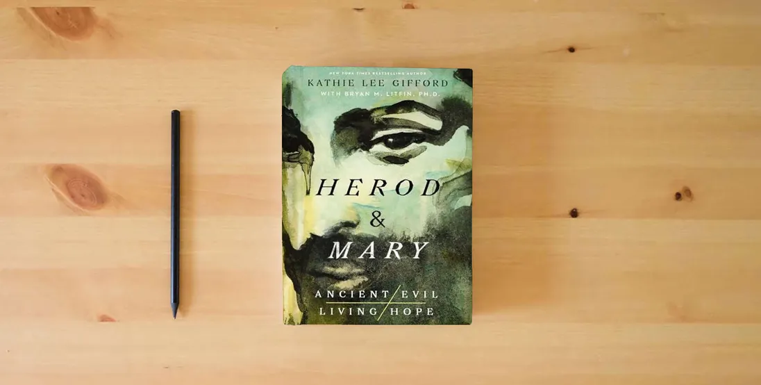 The book Herod and Mary: The True Story of the Tyrant King and the Mother of the Risen Savior (Ancient Evil, Living Hope)} is on the table