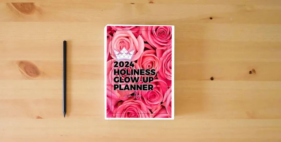 The book Holiness Glow-up Planner 2024} is on the table