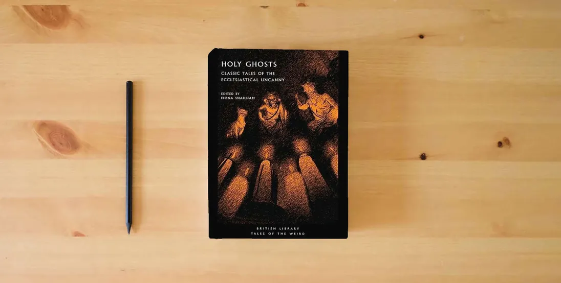 The book Holy Ghosts: Classic Tales of the Ecclesiastical Uncanny (Tales of the Weird)} is on the table