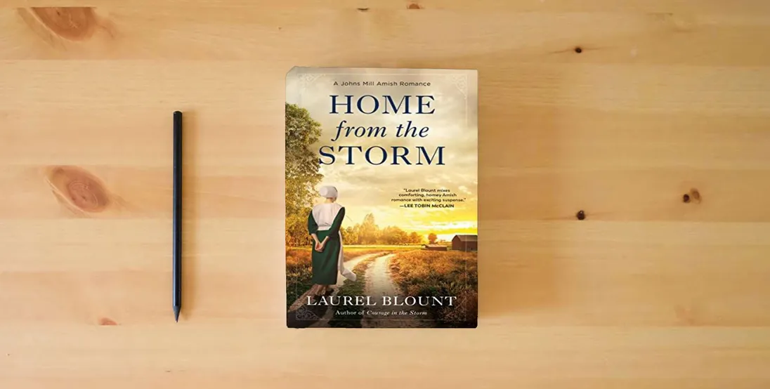 The book Home from the Storm (A Johns Mill Amish Romance)} is on the table