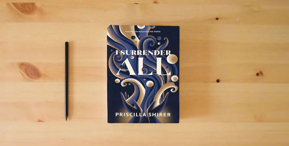 The book I Surrender All} is on the table