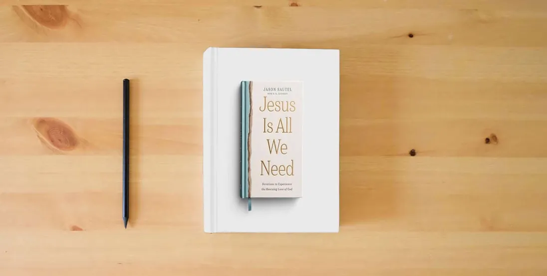 The book Jesus is All We Need: Devotions to Experience the Rescuing Love of God} is on the table