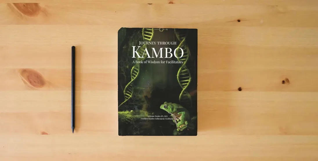 The book Journey through Kambo: A Book of Wisdom for Facilitators} is on the table