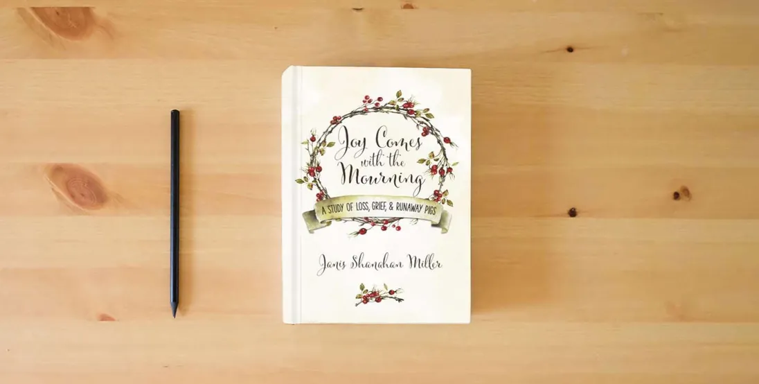 The book Joy Comes with the Mourning: A Study of Loss, Grief, and Runaway Pigs} is on the table