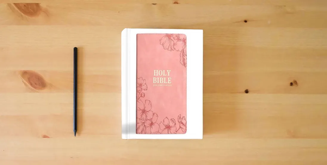 The book KJV Holy Bible, Giant Print with Cross-References, Pink LeatherTouch with Floral Cover Design, Thumb Index, Ribbon Marker, Red Letter, Full-Color Maps, Easy-to-Read MCM Type, King James Version} is on the table