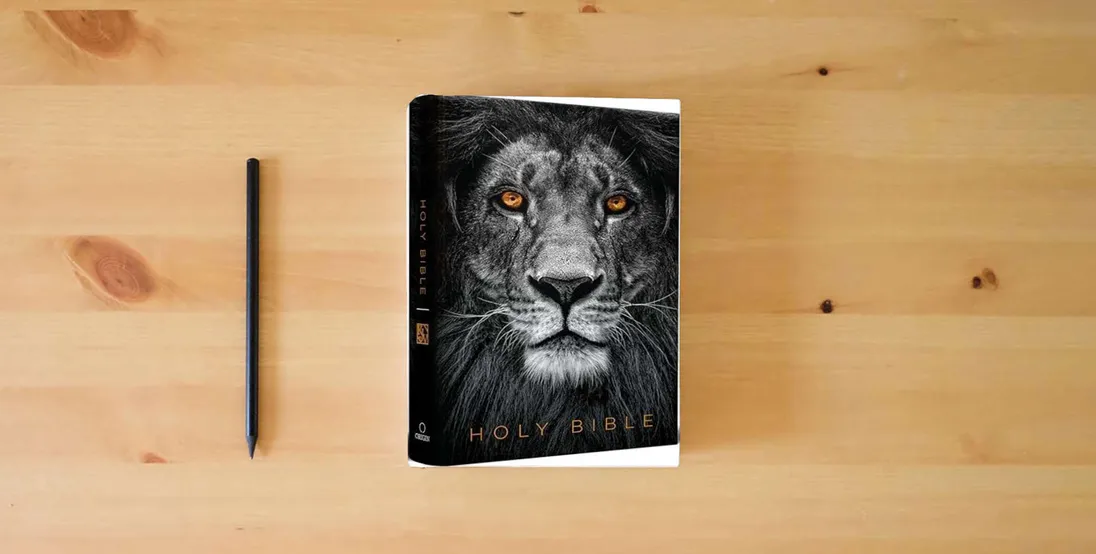 The book KJV Holy Bible, Large Print, Handy Size format, Hardcover, Lion of Judah, Ribbon Marker, and Red Letter} is on the table