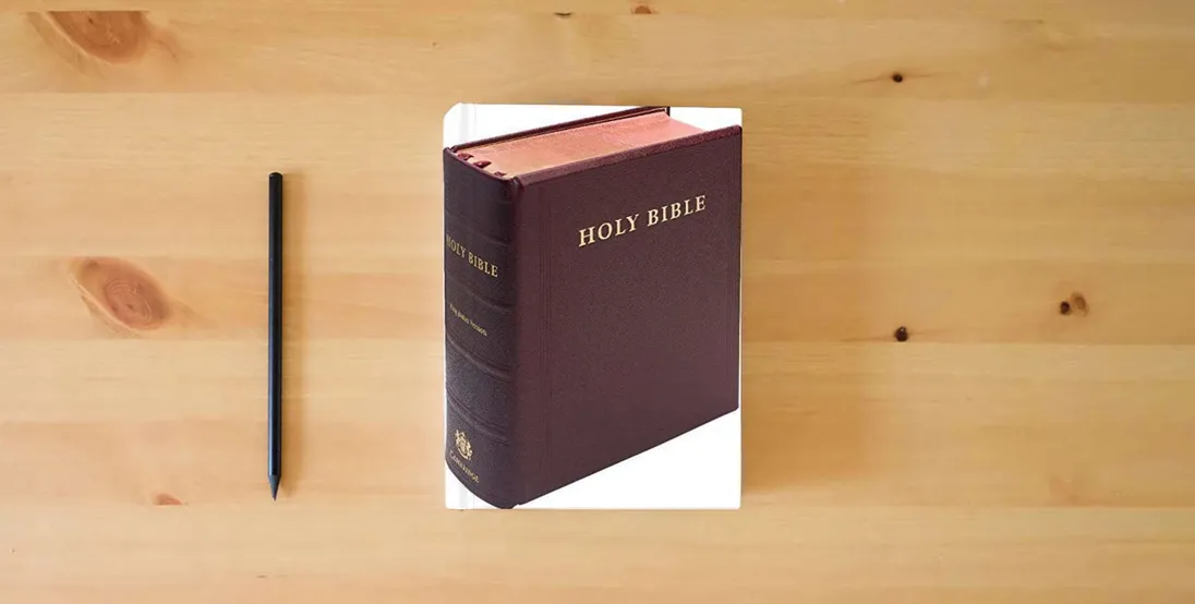 The book KJV Lectern Bible, Burgundy Goatskin Leather over Boards, KJ986:XB} is on the table