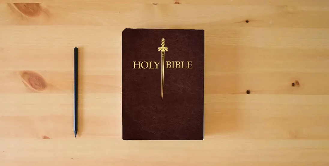 The book KJV Sword Bible, Large Print, Mahogany Genuine Leather, Thumb Index: (Red Letter, Premium Cowhide, Brown, 1611 Version) (King James Version Sword Bible)} is on the table