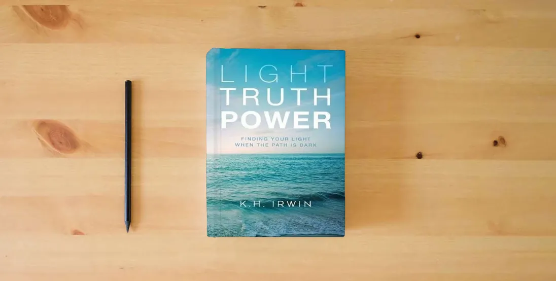 The book Light Truth Power: Finding Your Light When the Path is Dark} is on the table