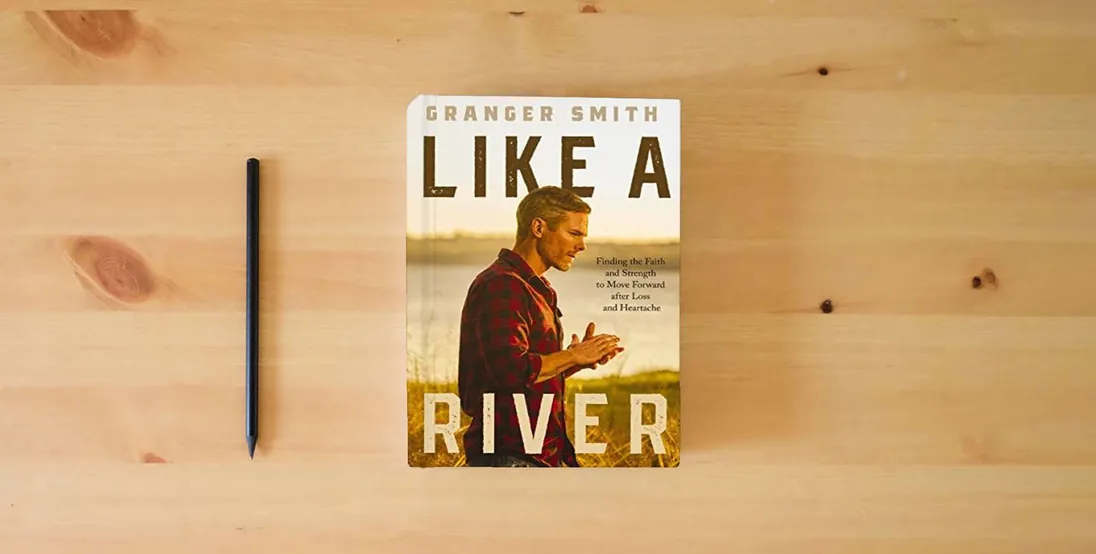 The book Like a River: Finding the Faith and Strength to Move Forward after Loss and Heartache} is on the table