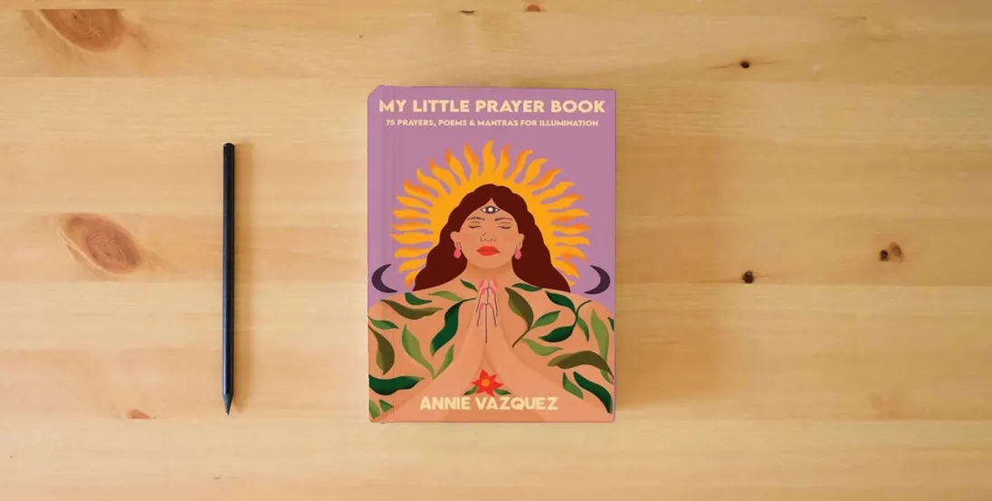 The book My Little Prayer Book: 75 Prayers, Poems & Mantras for Illumination} is on the table