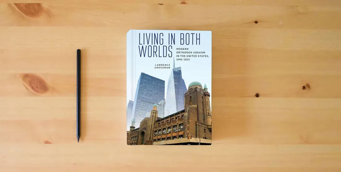 The book Living in Both Worlds: Modern Orthodox Judaism in the United States, 1945–2025} is on the table