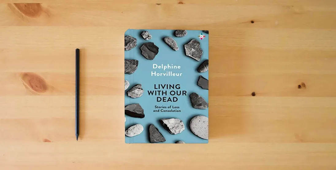 The book Living with Our Dead: Stories of Loss and Consolation} is on the table