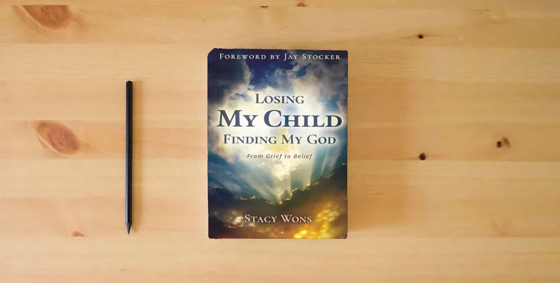 The book Losing My Child, Finding My God: From Grief to Belief} is on the table