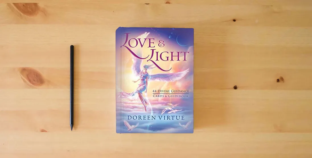 The book Love & Light: 44 Divine Guidance Cards and Guidebook} is on the table