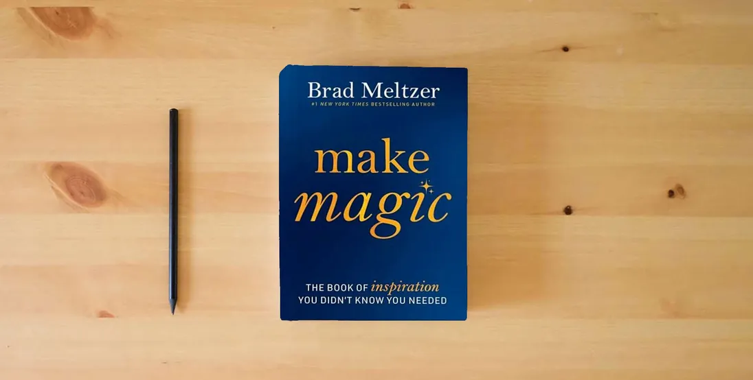 The book Make Magic: The Book of Inspiration You Didn't Know You Needed} is on the table