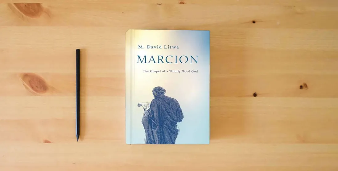 The book Marcion: The Gospel of a Wholly Good God} is on the table