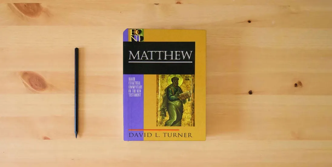 The book Matthew (Baker Exegetical Commentary on the New Testament)} is on the table