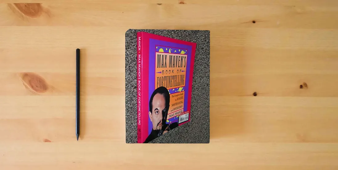 The book Max Maven's Book of Fortunetelling} is on the table