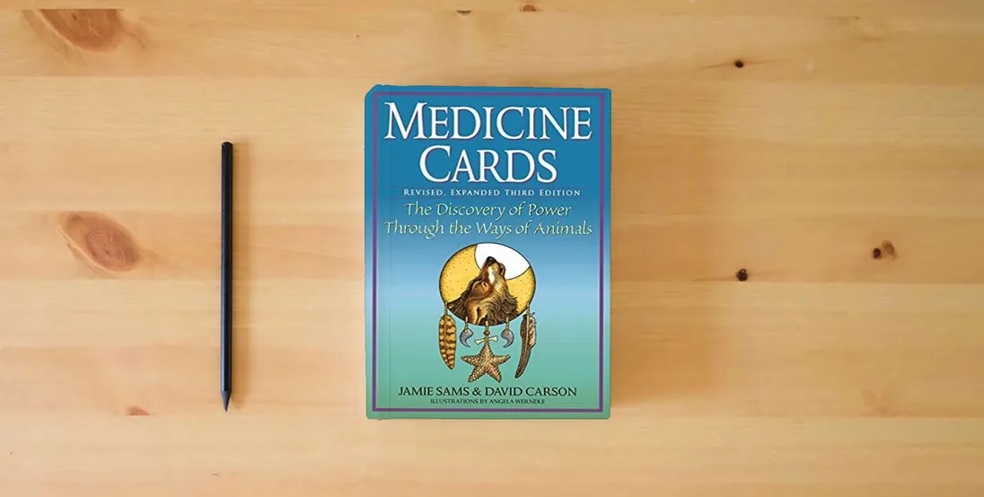 The book Medicine Cards: Revised, Expanded Third Edition} is on the table