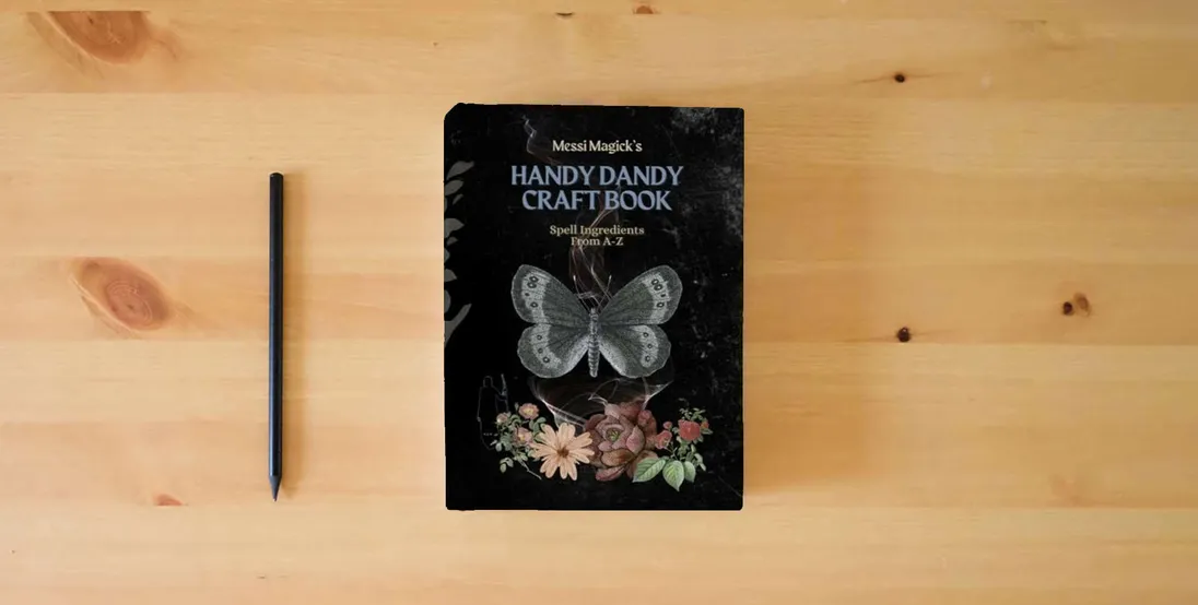 The book Messi Magick's Handy Dandy Craft Book: Spell Ingredients from A to Z} is on the table