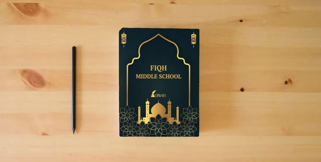 The book Middle School Fiqh} is on the table