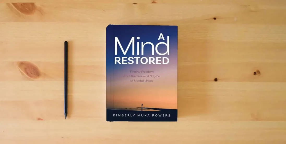 The book A Mind Restored: Finding Freedom from the Shame and Stigma of Mental Illness} is on the table