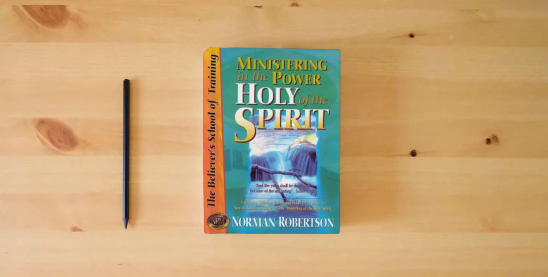 The book Ministering in the Power of the Holy Spirit (Believer's School of Training)} is on the table