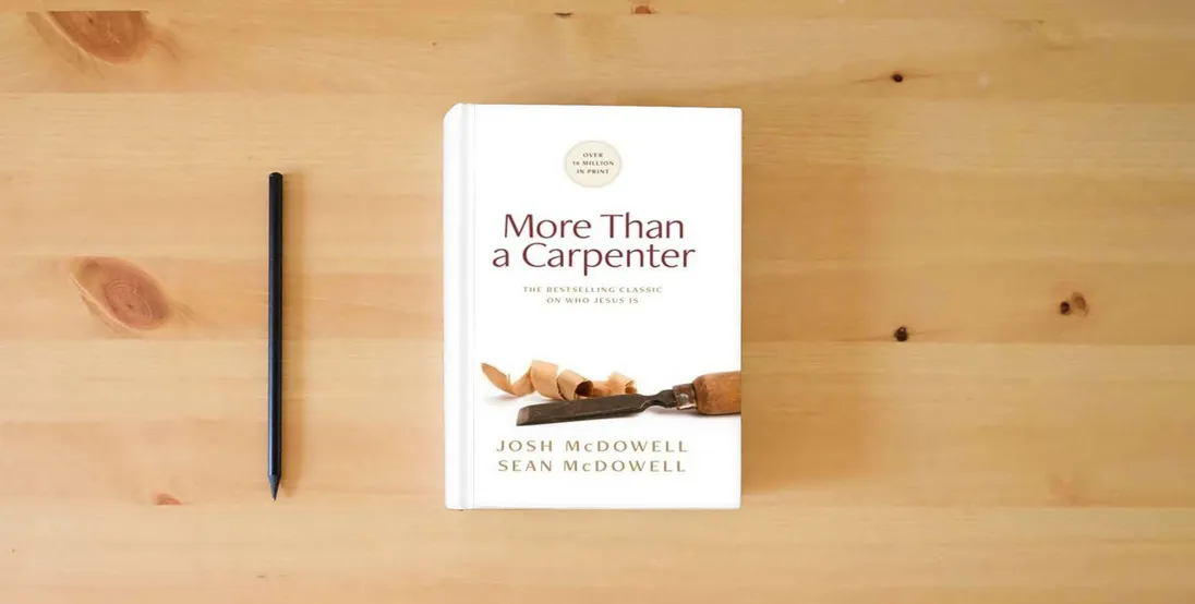 The book More Than a Carpenter} is on the table