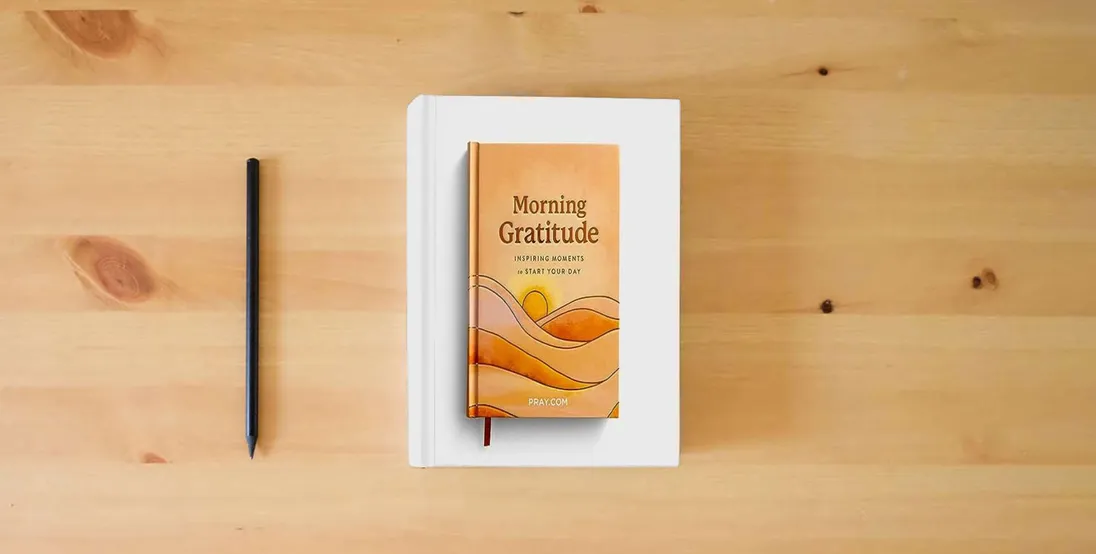 The book Morning Gratitude: Inspiring Moments to Start Your Day - Prayer Devotional} is on the table