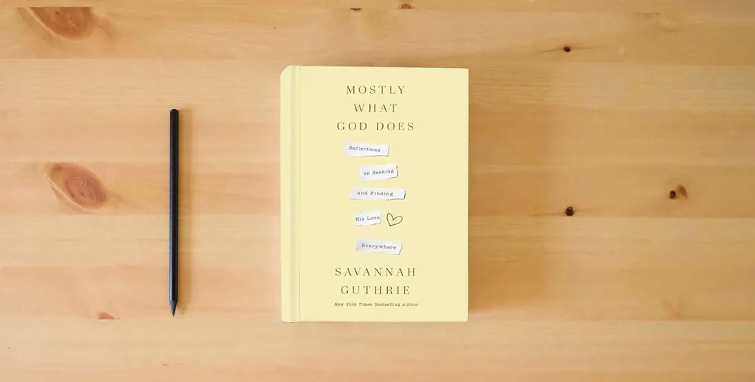 The book Mostly What God Does: Reflections on Seeking and Finding His Love Everywhere} is on the table