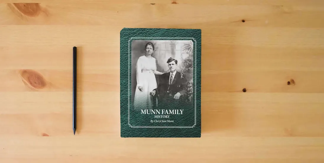 The book Munn Family History} is on the table