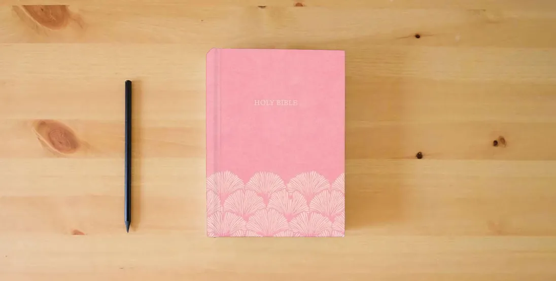 The book NASB Large Print Thinline Bible, Value Edition, Soft Pink LeatherTouch, Black Letter, Presentation Page, Sewn Binding, Full-Color Maps, Easy-to-Read Bible Karmina Type} is on the table