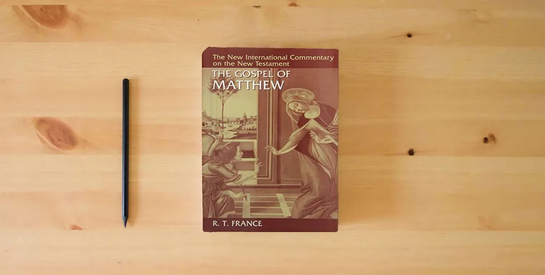 The book New International Commentary on the New Testament (Set of 18 volumes)} is on the table