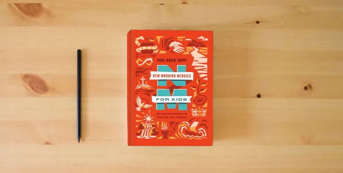 The book New Morning Mercies for Kids: 60 Devotions to Focus on Jesus} is on the table
