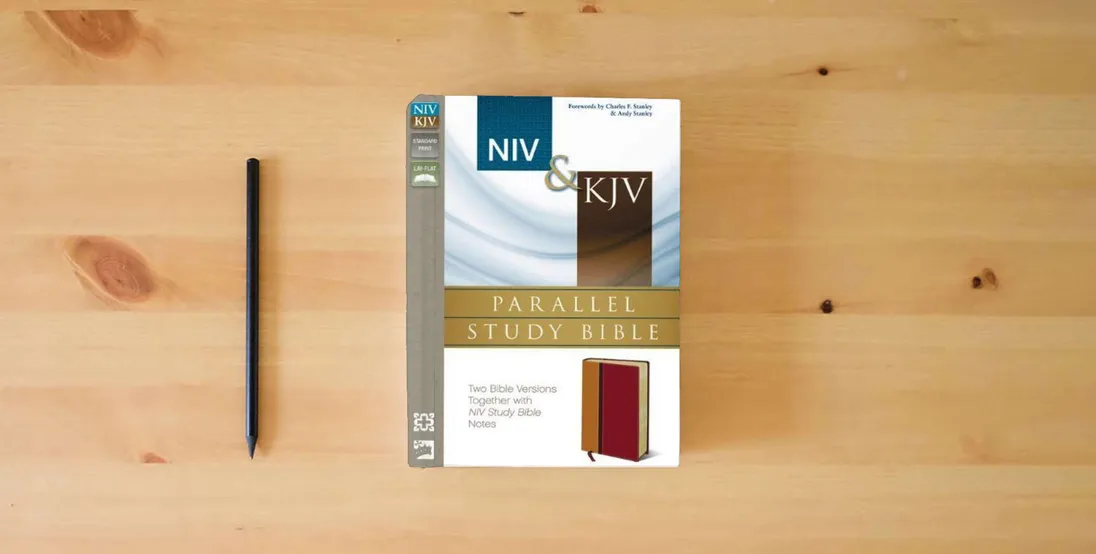The book NIV, KJV, Parallel Study Bible, Imitation Leather, Red: Two Bible Versions Together for Study and Comparison} is on the table