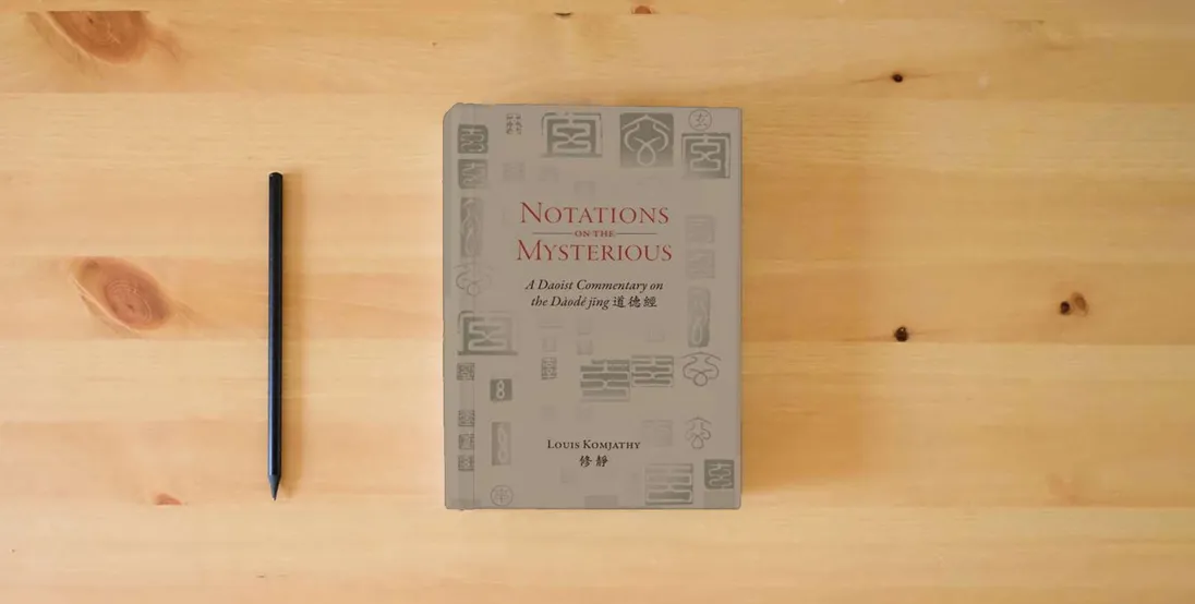 The book Notations on the Mysterious: A Daoist Commentary on the Dàodé jīng 道德經 (Daoist Commentary Series)} is on the table