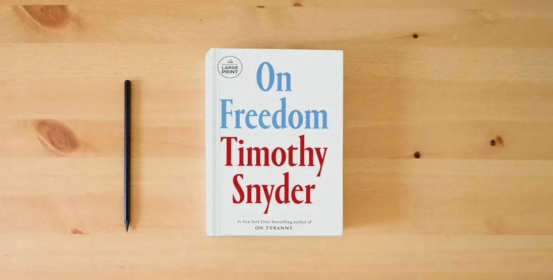 The book On Freedom} is on the table
