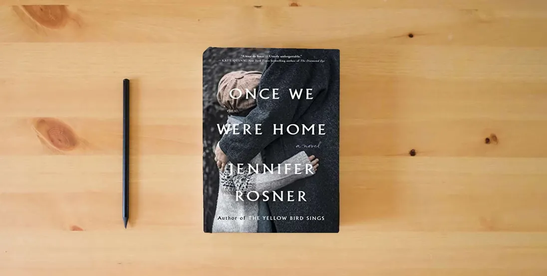 The book Once We Were Home: A Novel} is on the table