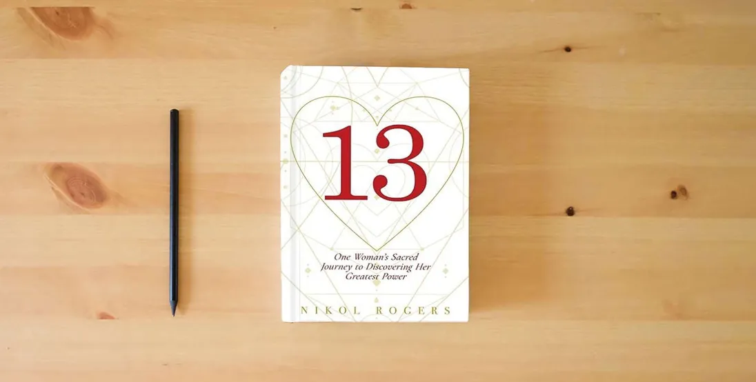 The book 13: One Woman's Sacred Journey to Discovering Her Greatest Power} is on the table