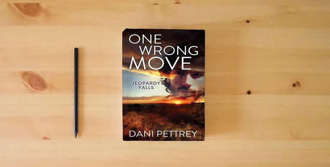 The book One Wrong Move: Jeopardy Falls} is on the table