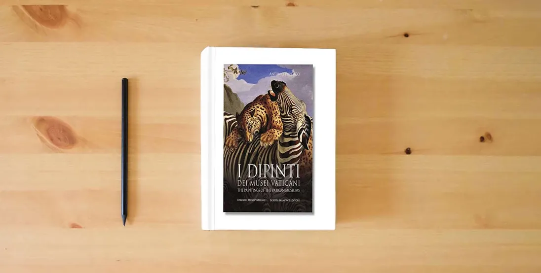 The book Paintings of the Vatican Museums} is on the table