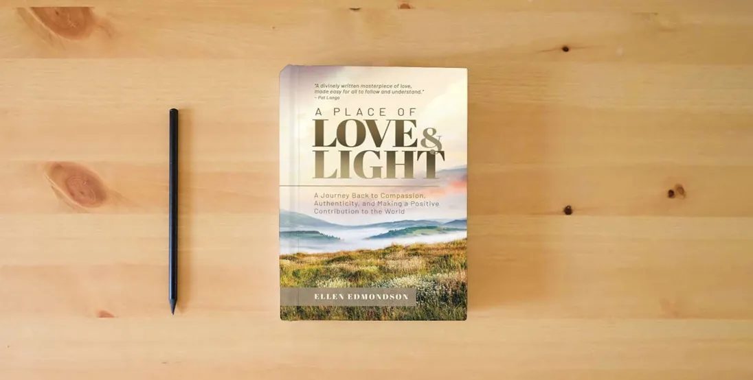 The book A Place of Love & Light: A Journey Back to Compassion, Authenticity, and Making a Positive Contribution to the World} is on the table