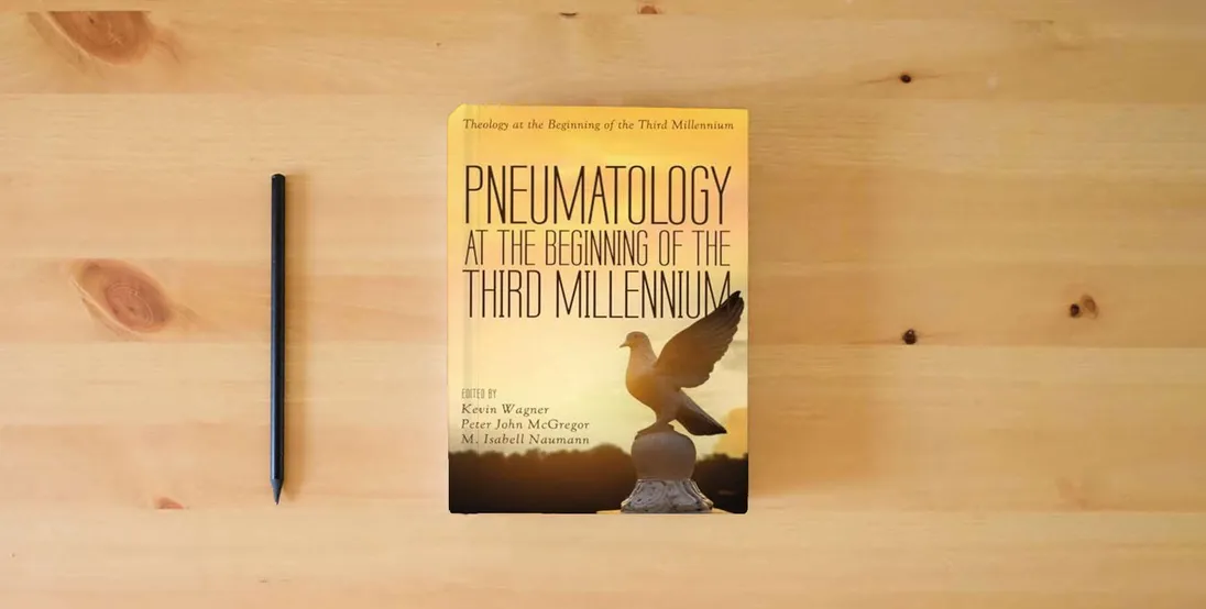 The book Pneumatology at the Beginning of the Third Millennium (Theology at the Beginning of the Third Millennium)} is on the table