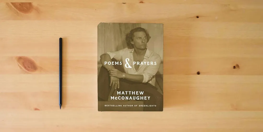 The book Poems & Prayers} is on the table