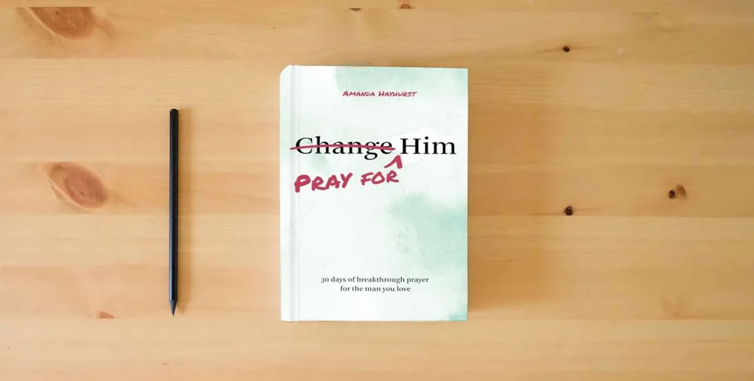 The book Pray for Him: 30 days of breakthrough prayer for the man you love} is on the table