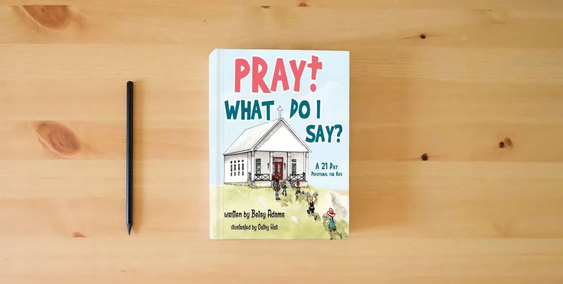 The book Pray! What Do I Say?: A 21 Day Devotional for Kids} is on the table