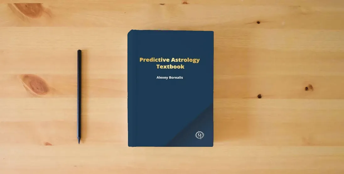 The book Predictive Astrology Textbook} is on the table