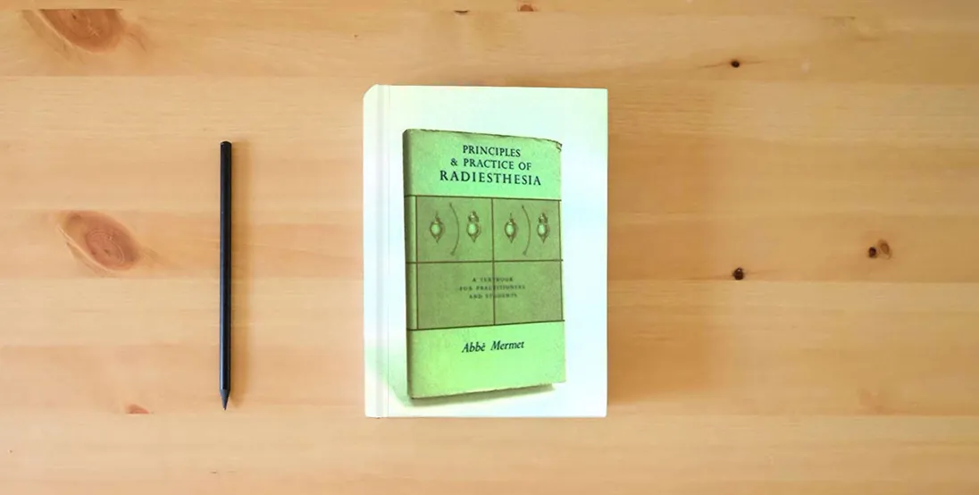 The book Principles and Practice of Radiesthesia: Textbook for Practitioners and Students} is on the table